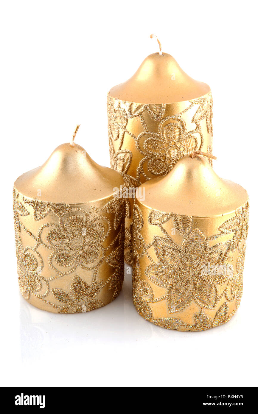 three golden candles isolated on white background Stock Photo Alamy