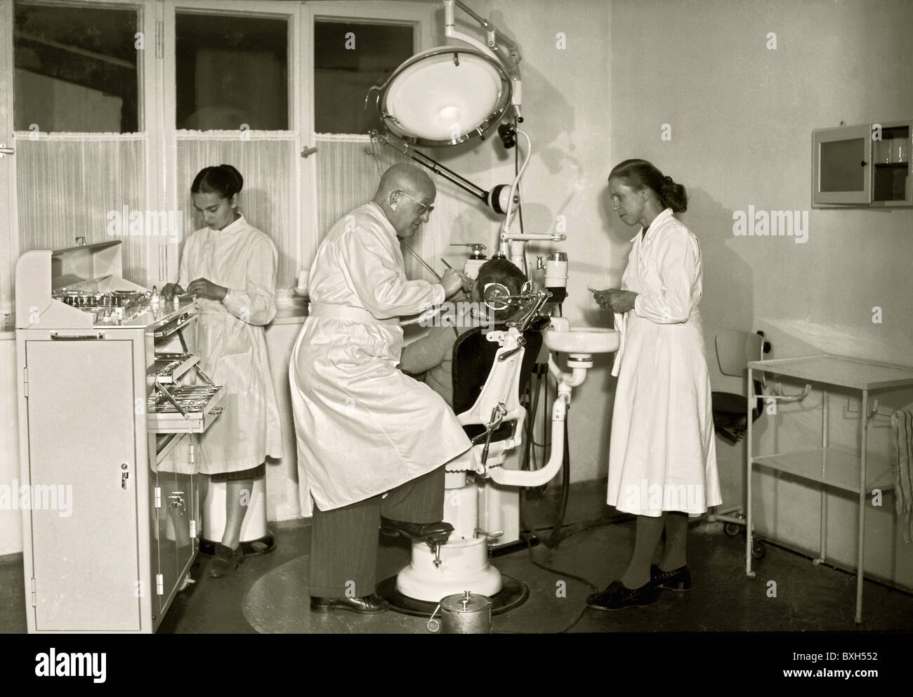 medicine, dentistry, dentist during treatment, Bavaria, 1952