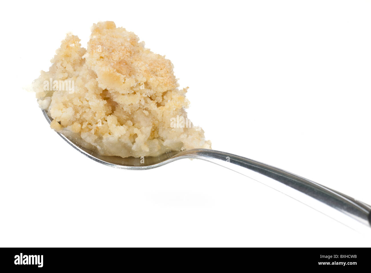 Spoonful of apple crumble Stock Photo