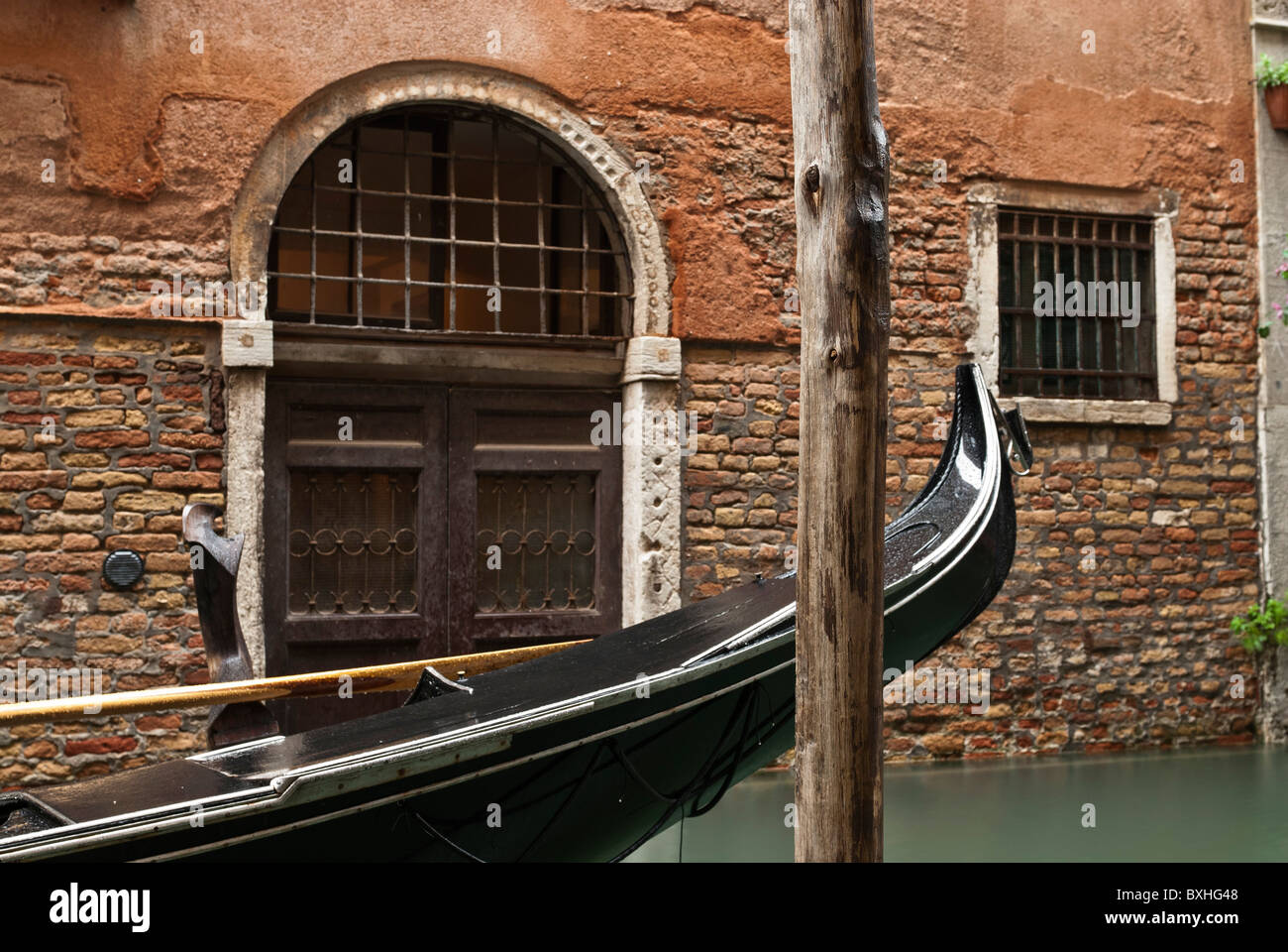 Gondolas and Venetian door, Venice, Italy, Europe Stock Photo