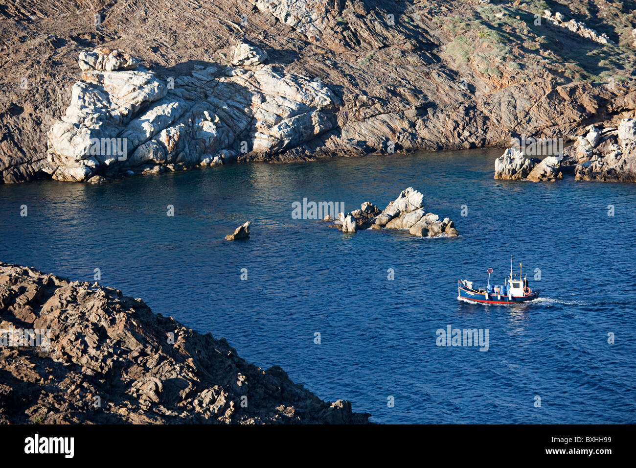 Fishing boat sailing around Cap de Creus Parc Natural de Cap de Creus Emporda Catalunya Spain Stock Photo
