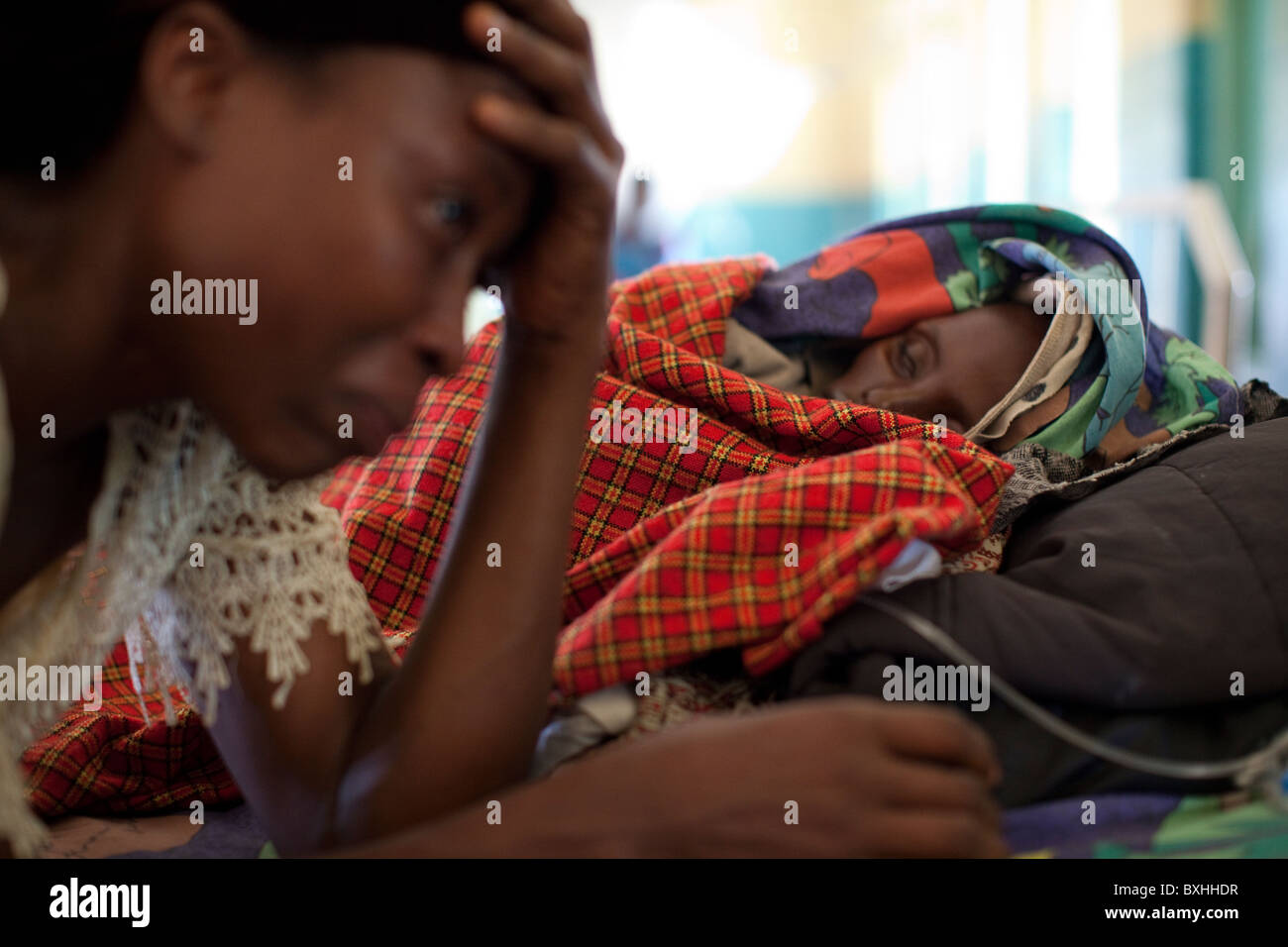 A woman grieves for her daughter dying of AIDS in Amuria, Uganda, East Africa. Stock Photo