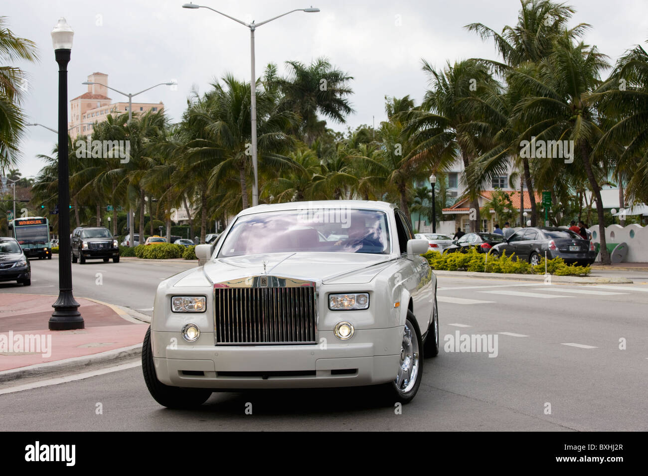 White Rolls Royce Phantom four-door limousine turns off Collins Avenue, South Beach, Miami, USA Stock Photo