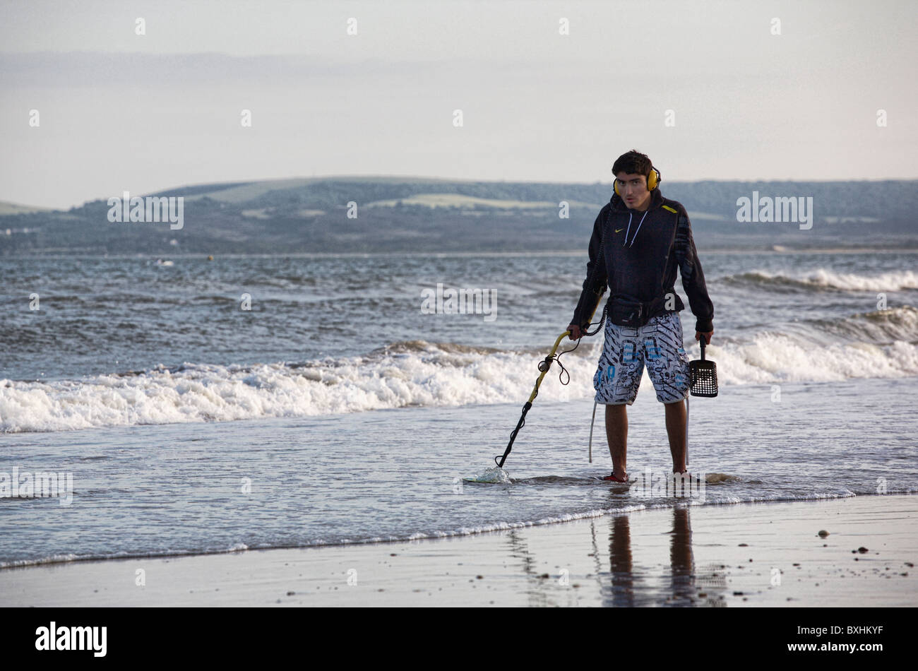 Metal detecting on Bournemouth beach, Bournemouth, England Stock Photo