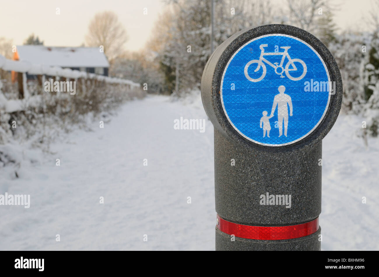 A snowcovered cycle and footpath in winter Stock Photo Alamy