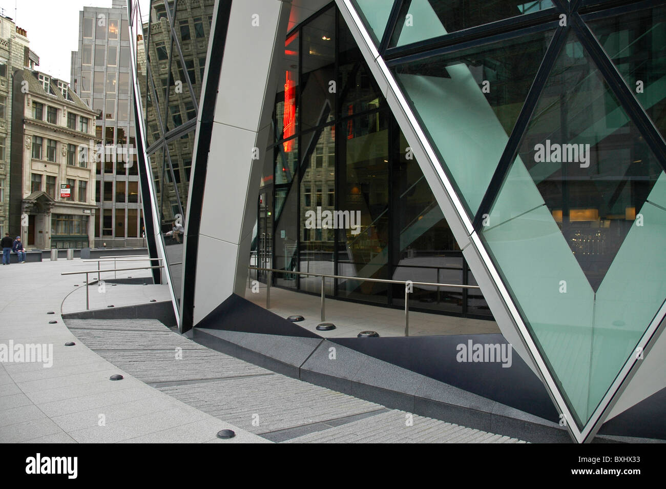 Swiss Re detail near entrance of building 'The Gherkin', 30 St Mary Axe.  City of  London Uk ground level Stock Photo