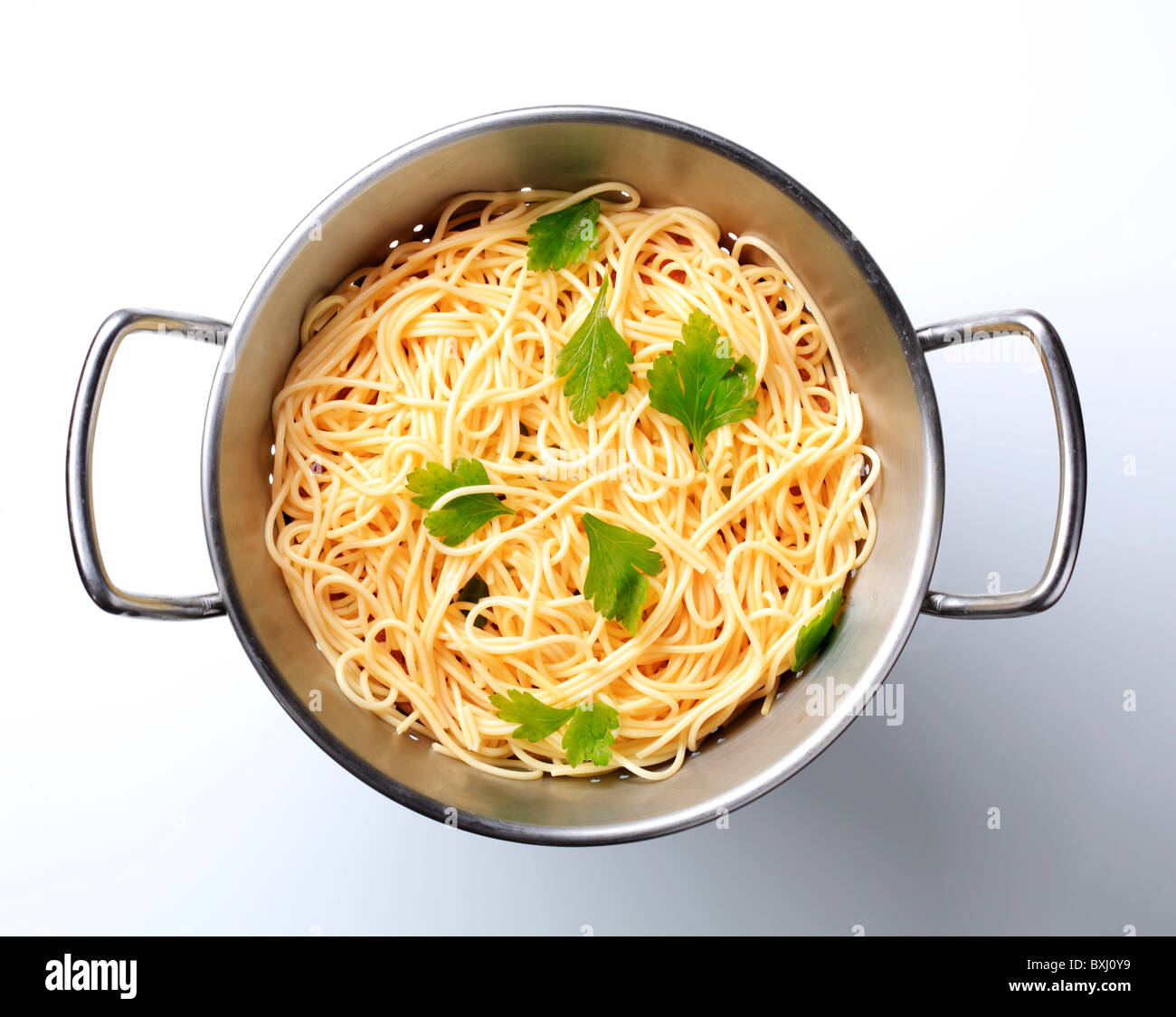 Cooked spaghetti in a colander Stock Photo
