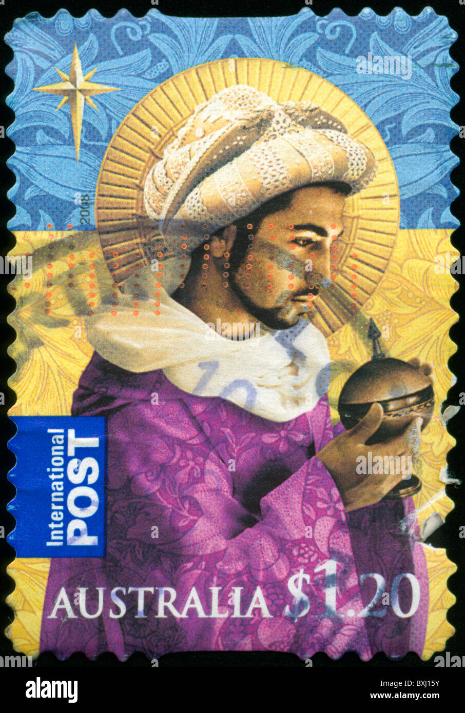 Christmas stamp from Australia with picture of a Wise man bearing a