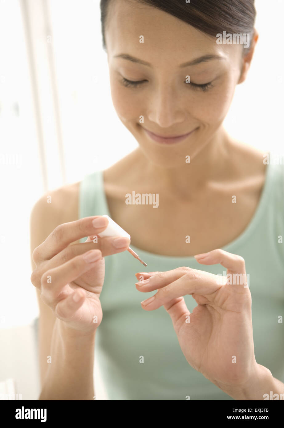 A woman painting her nails Stock Photo Alamy