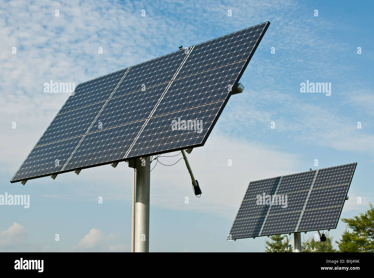 Photovoltaic solar panel arrays with blue sky and white clouds in the ...