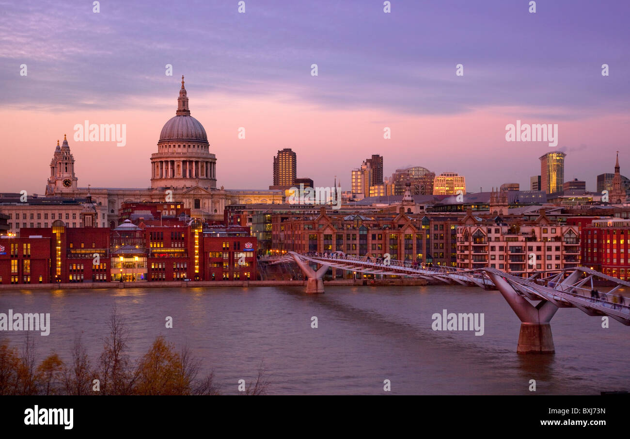 Evening light on St Paul's Cathedral and Millennium bridge from Tate Modern on south bank of Thames, London, England Stock Photo