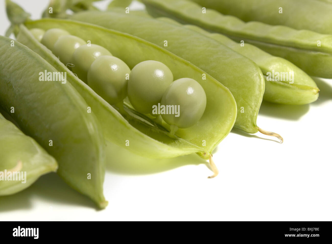 Background with the pods of green peas Stock Photo - Alamy