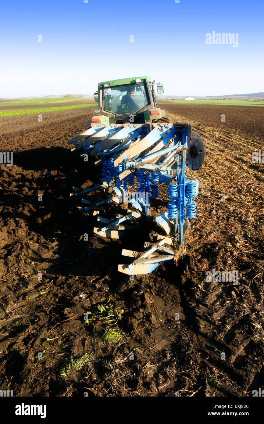 Tractor with plow Stock Photo - Alamy