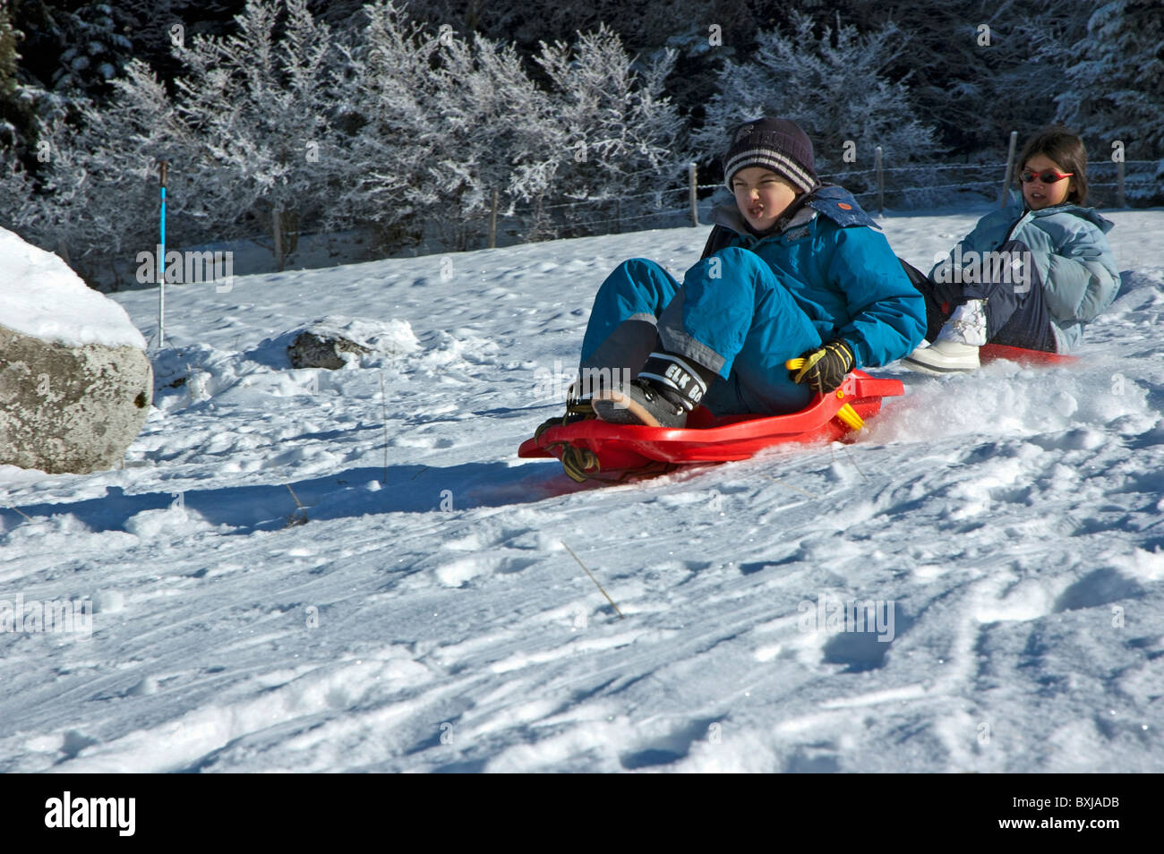 Children Sledging Stock Photo