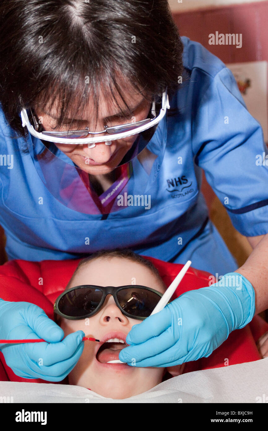UK -- Scotland -- 2010. Minister for Public Health, Shona Robison teaching nursery pupils how to clean their teeth properly. Stock Photo