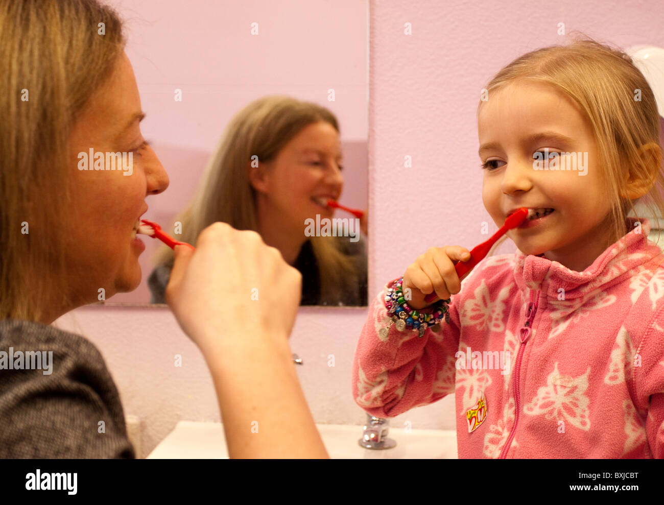 UK -- Scotland -- 2010. Minister for Public Health, Shona Robison teaching nursery pupils how to clean their teeth properly. Stock Photo