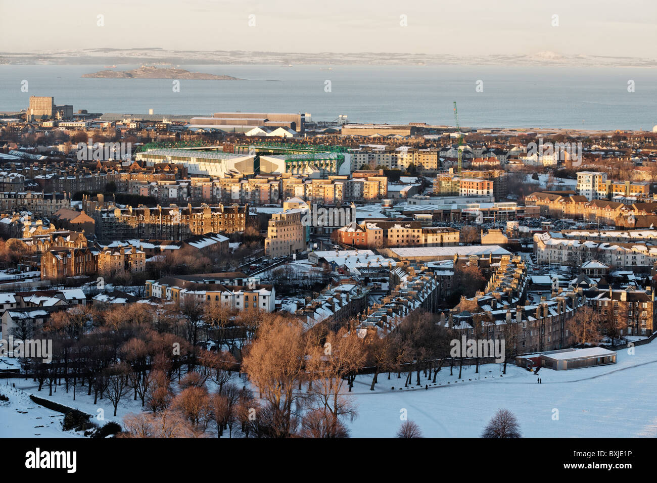 Rooftop view over Holyrood Park towards the Hibernian Football Club Easter Road football stadium, Edinburgh, Scotland, UK. Stock Photo