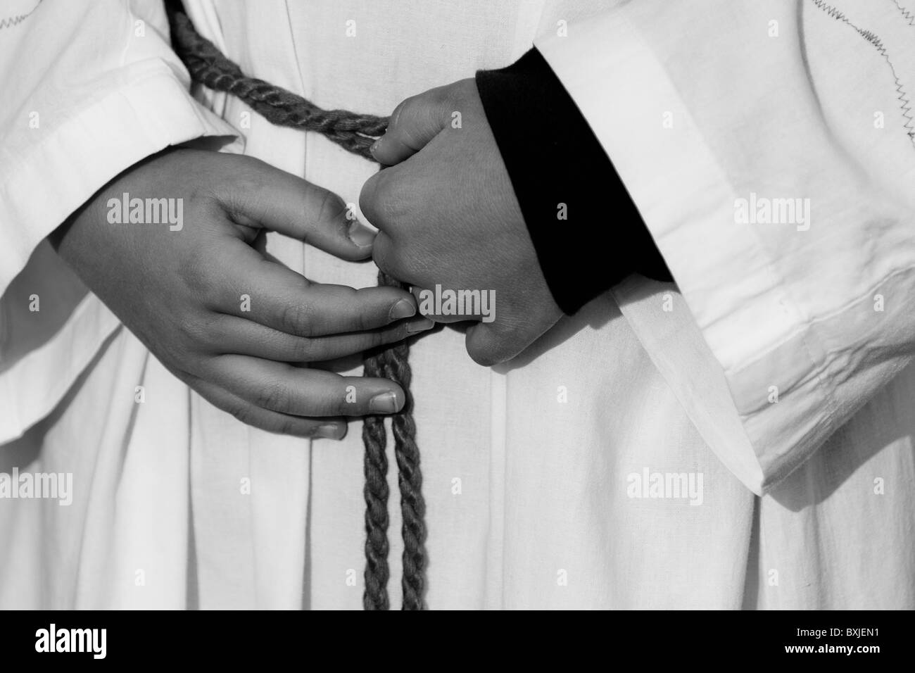 Pope Rope A young altar boy holding his rope belt upon the mass served by the ...