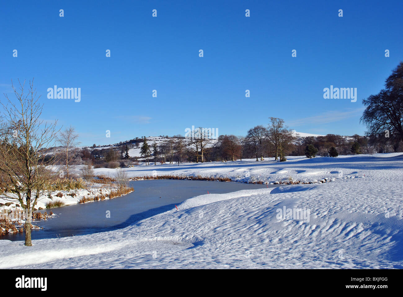 snow on a golf course Stock Photo