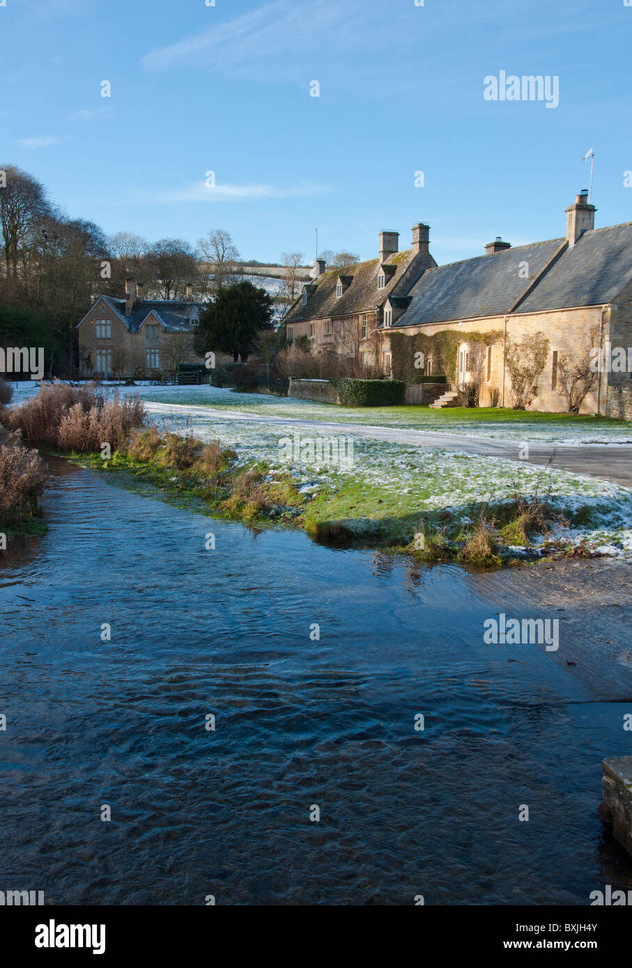 A ford across the river Eye in the picturesque Cotswold village of Upper Slaughter, Gloucestershire, England. Stock Photo