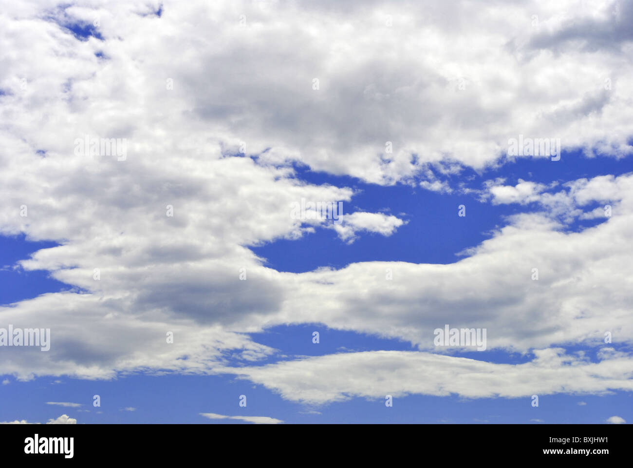 sun against the blue sky with white clouds Stock Photo - Alamy