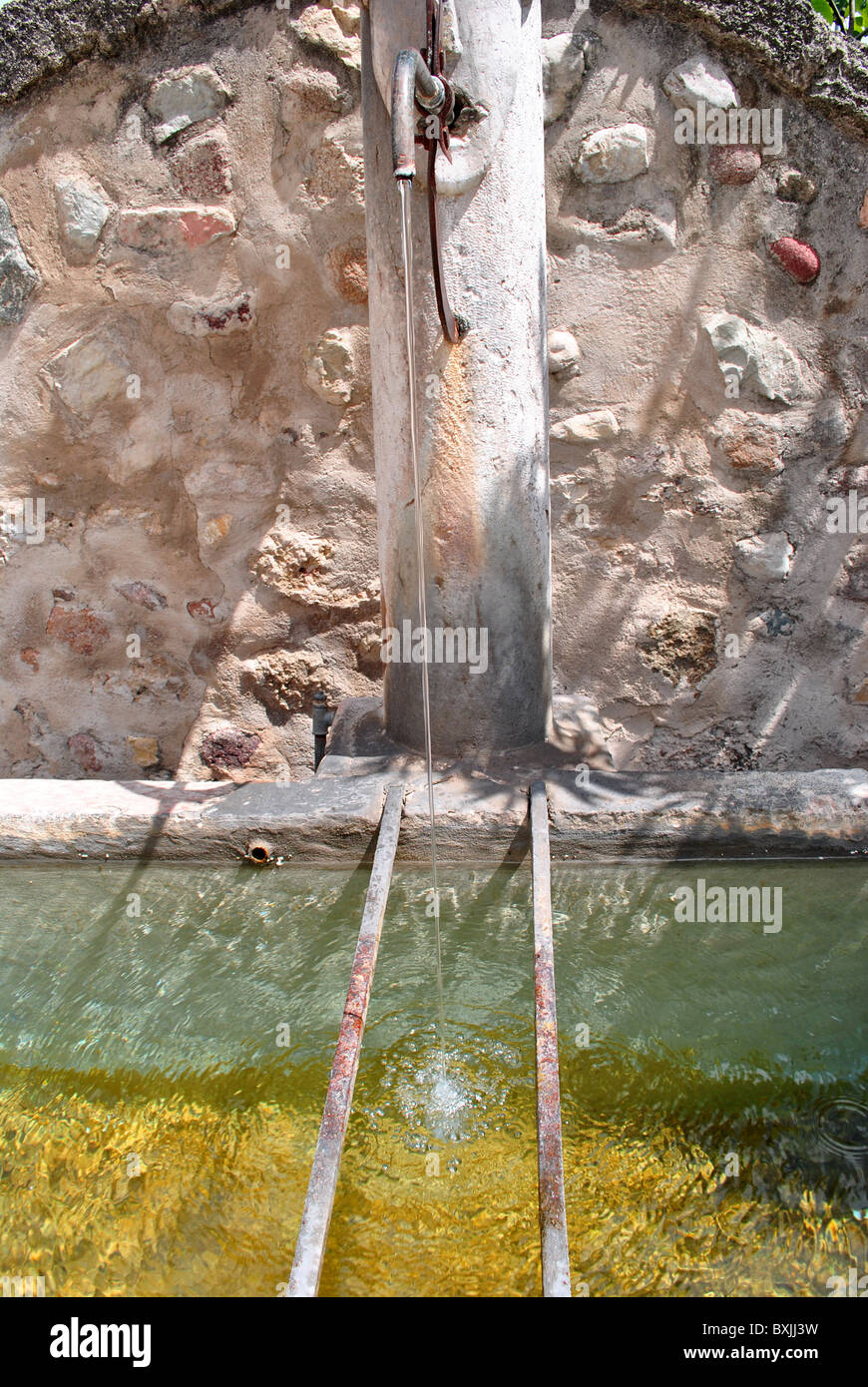 old fountain source of pure water from the mountains of Trentino south tyrol Stock Photo