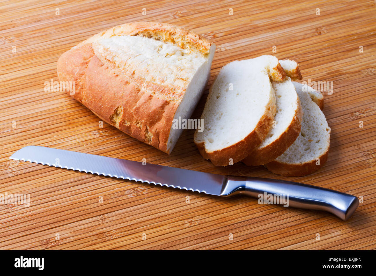 The bread cut by slices and knife for bread Stock Photo Alamy