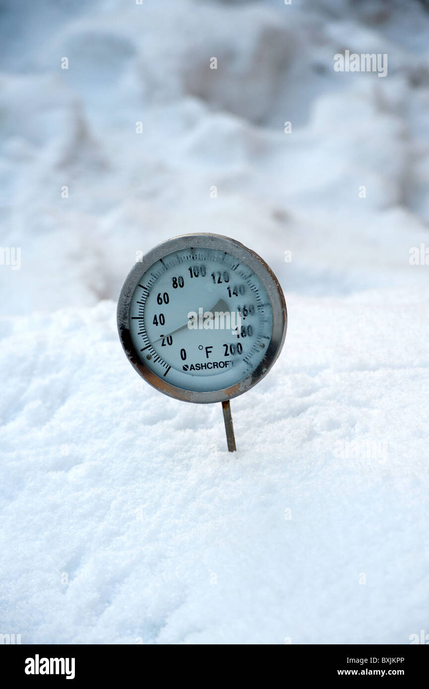 Thermometer Placed In Snow Showing The Ambient Air Temperature As Twenty Degrees Fahrenheit Or Roughly Minus Six Celsius Thermometer Placed In Snow Showing The Ambient Air Temperature As Twenty Degrees Fahrenheit Or Roughly Minus Six Celsius