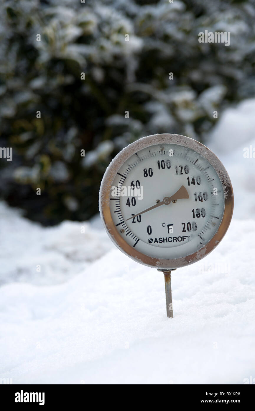 Thermometer Placed In Snow Showing The Ambient Air Temperature As 20 Degrees Fahrenheit Or Roughly Minus 6 Celsius Thermometer Placed In Snow Showing The Ambient Air Temperature As 20 Degrees Fahrenheit Or Roughly Minus 6 Celsius