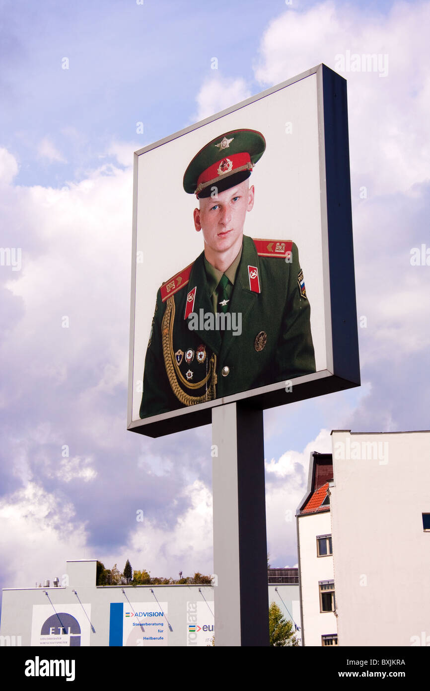 Giant photograph of a Soviet soldier in Berlin near the old Check-Point Charlie crossing between East and West Stock Photo