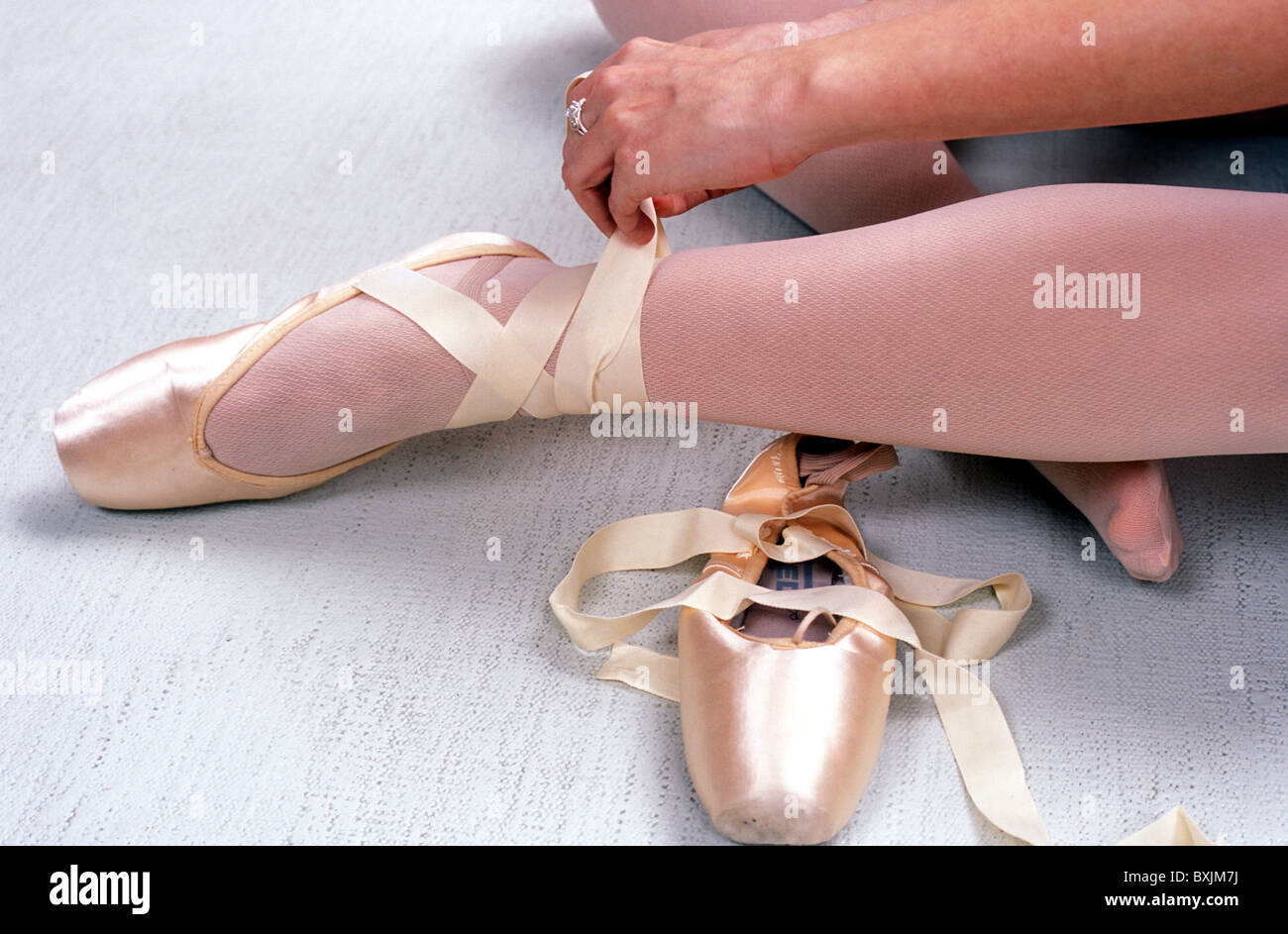 Ballerina Tying Ballet Pointe Shoes Stock Photo Alamy