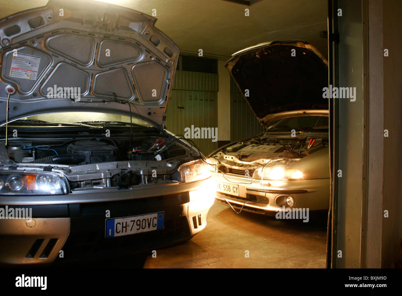 Two cars in the garage for the engine starting Stock Photo Alamy