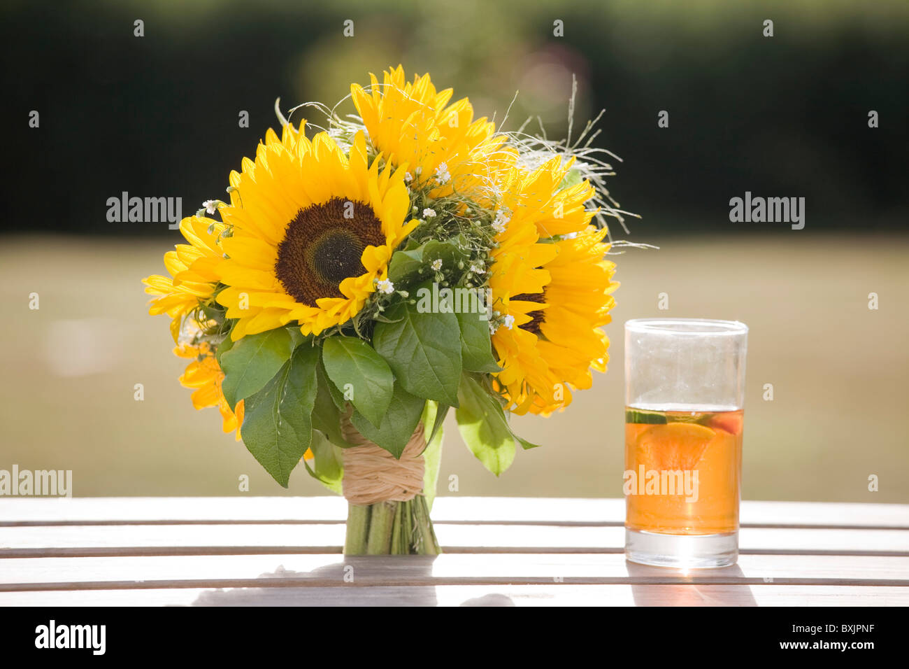 sunflowers bouquet and drink at a wedding Stock Photo