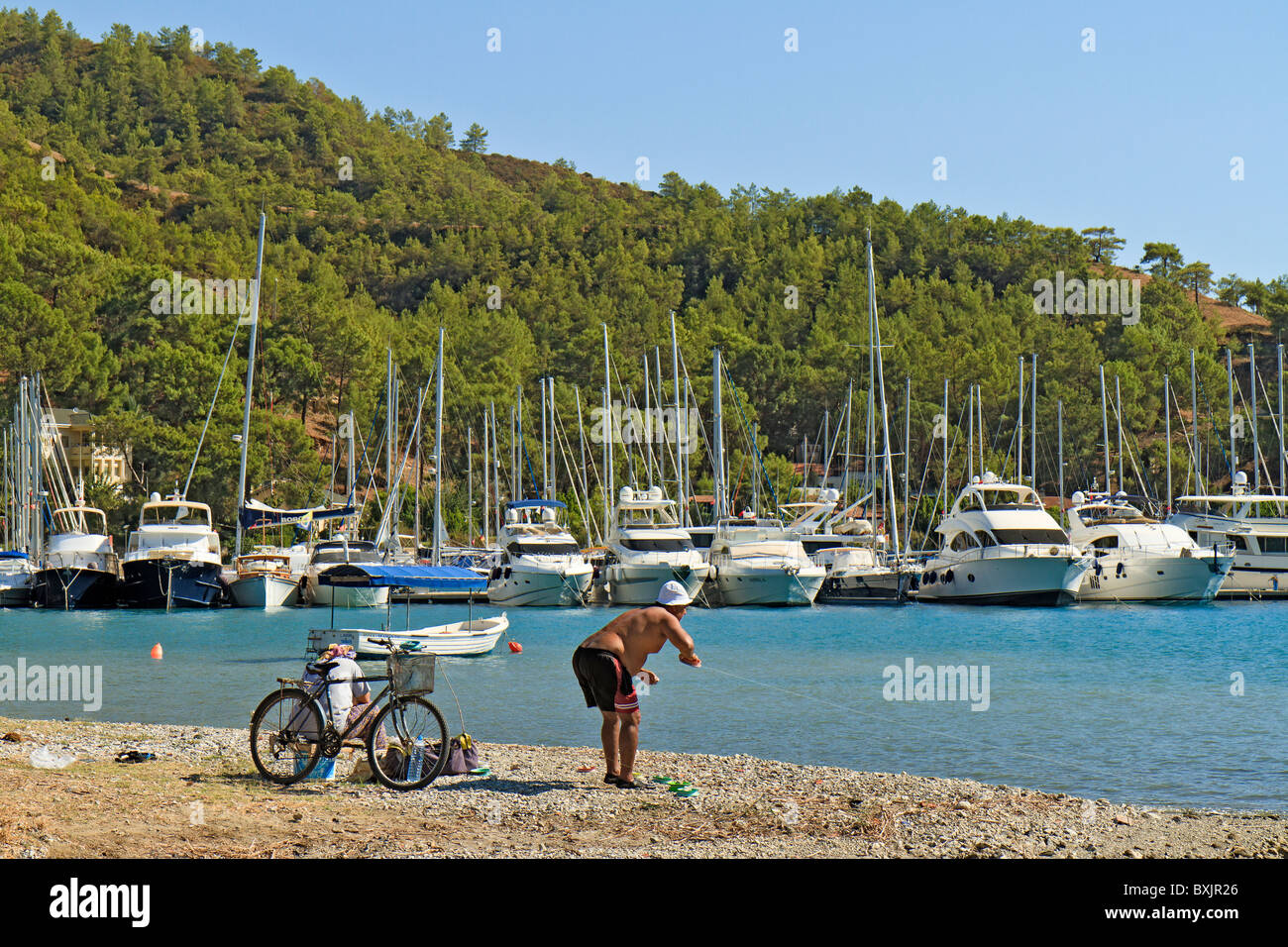 Turkey Gocek Fisherman Attending To His Line Stock Photo