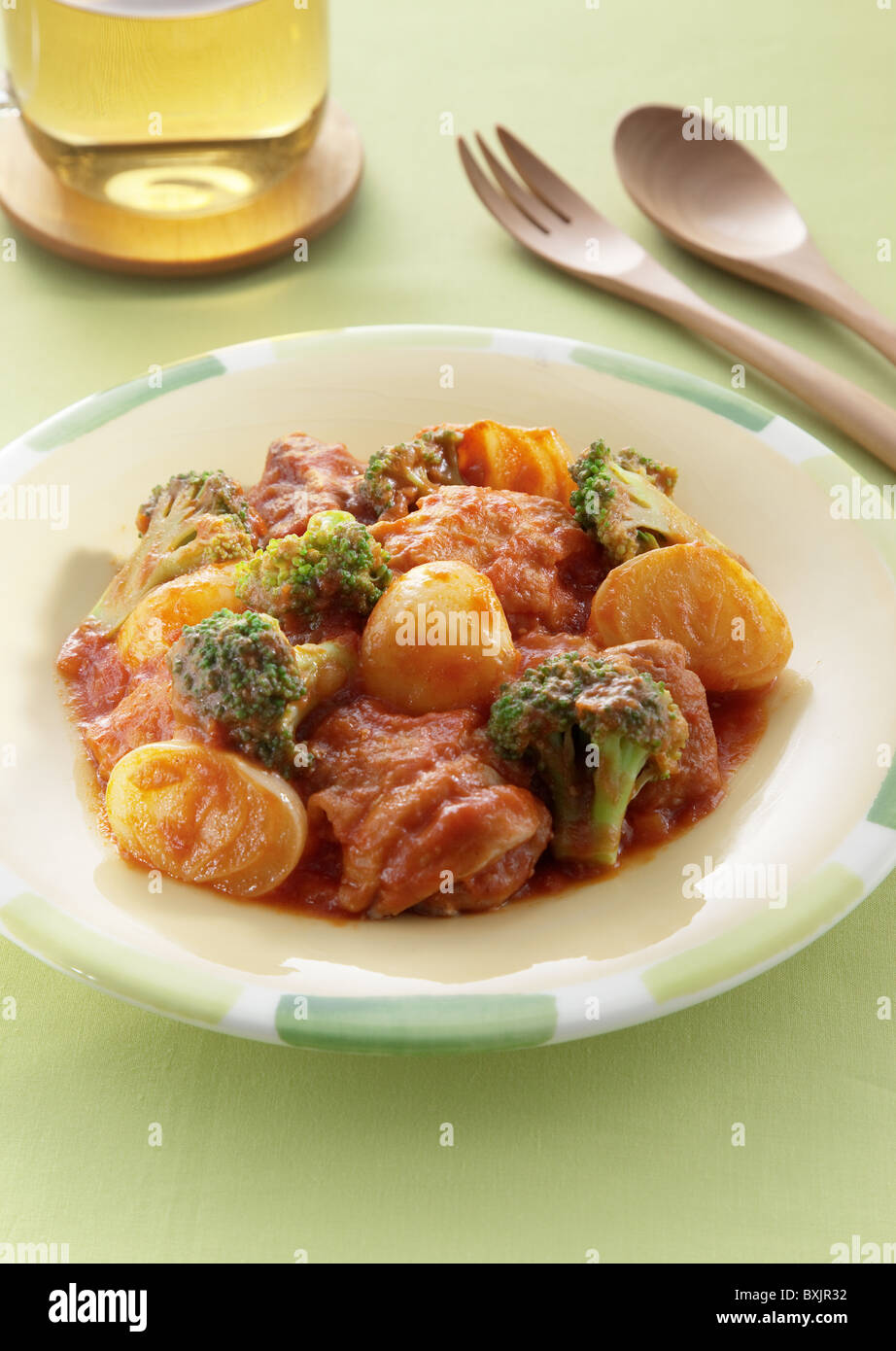 Chicken simmered in tomate sauce Stock Photo Alamy