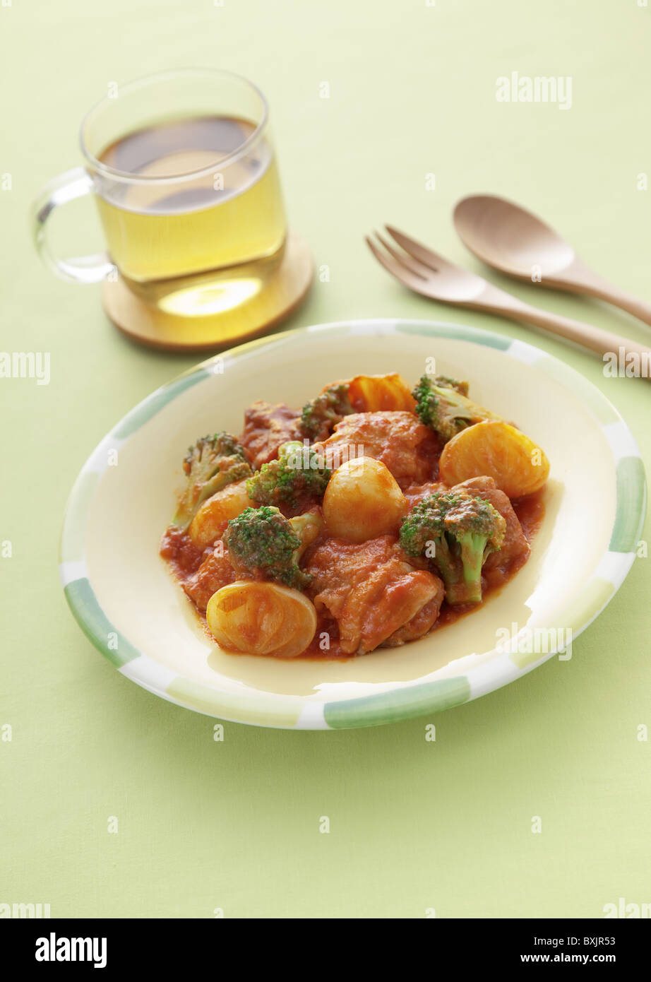 Chicken simmered in tomate sauce Stock Photo Alamy