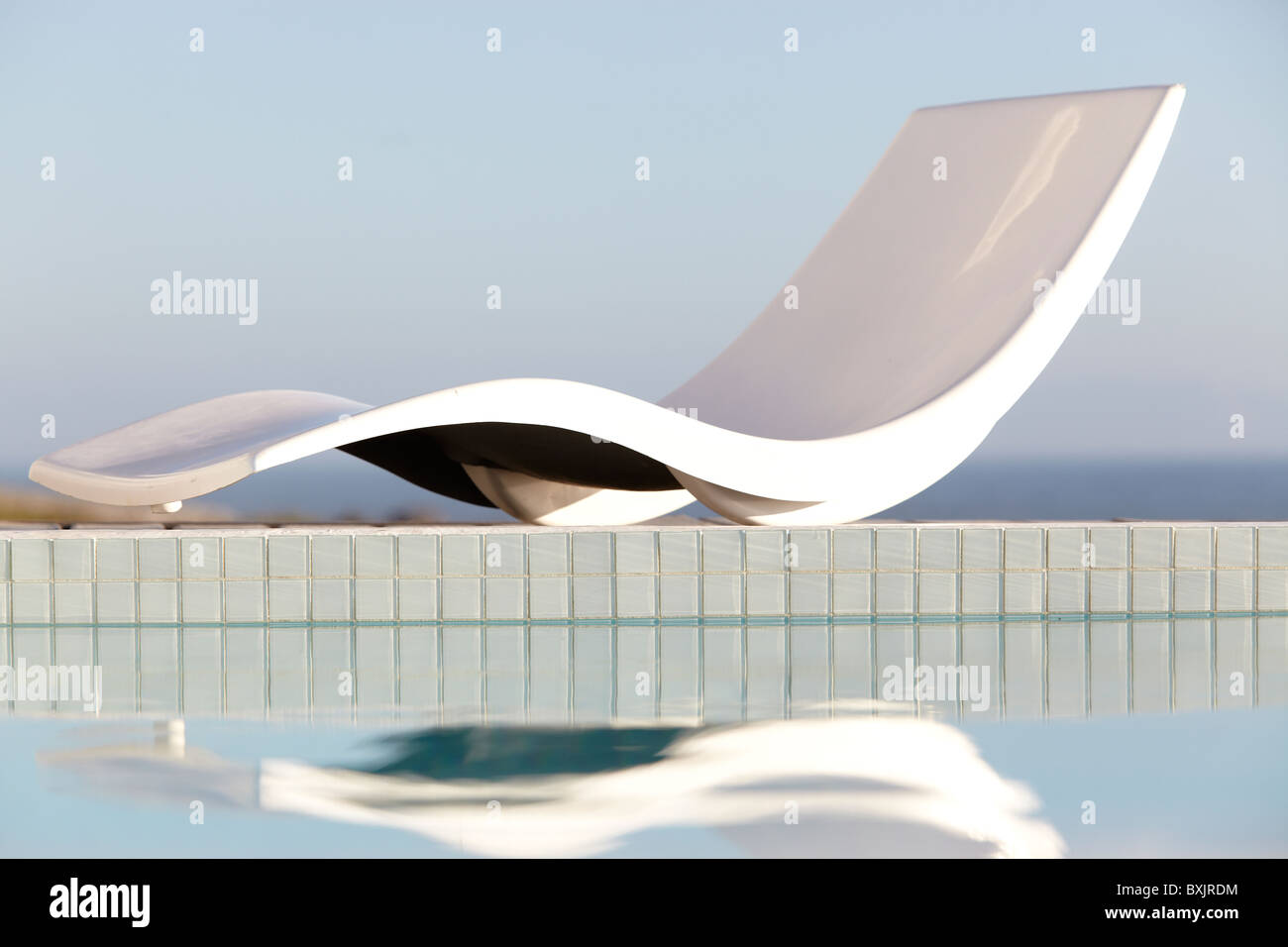 Abstract sun lounger by the pool side Stock Photo