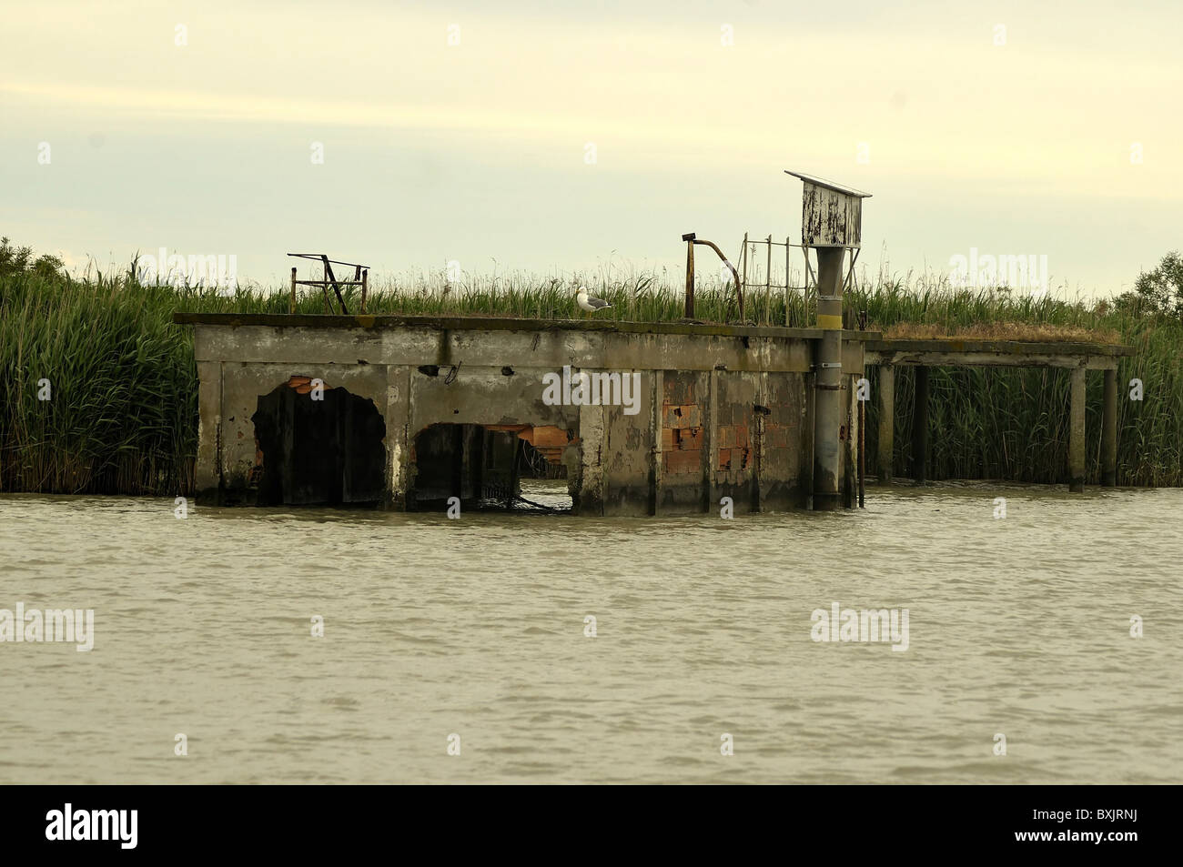 A view of the Po' delta with a central repository for old fishing boats Stock Photo