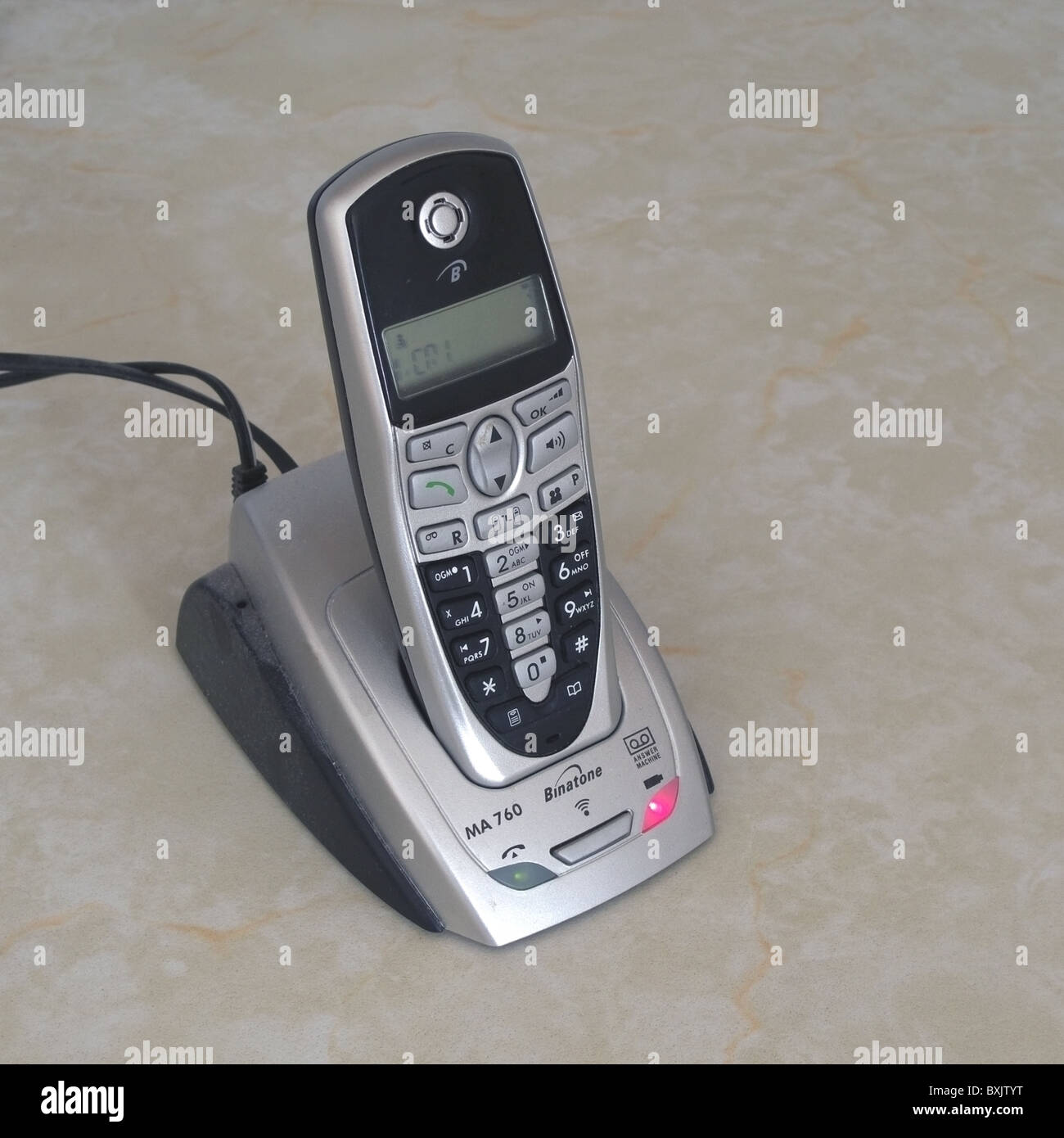 Binatone Cordless Telephone Charging Up in it's Docking Station, UK