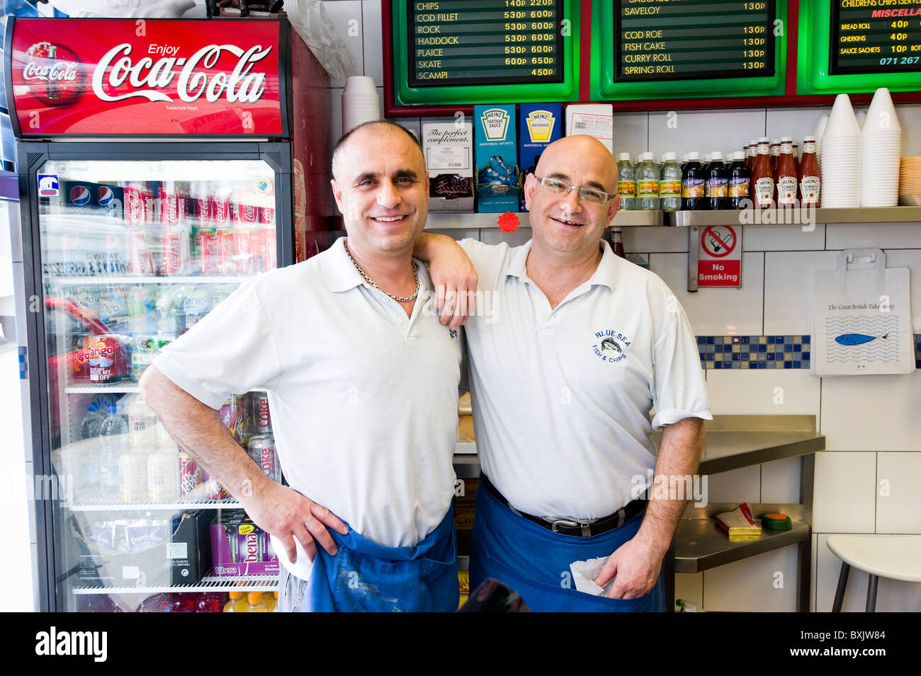 Portrait of Cypriot flsh and chip shop owners, London, England, UK Stock Photo