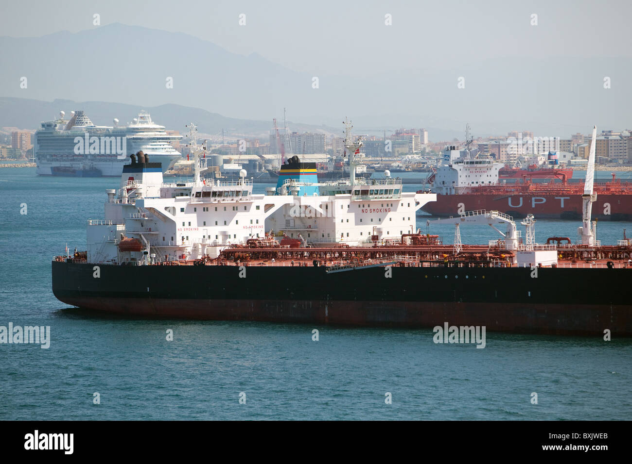 Two Oil tankers alongside each other performing 'ship to ship' oil cargo transfer. Gibraltar. Stock Photo