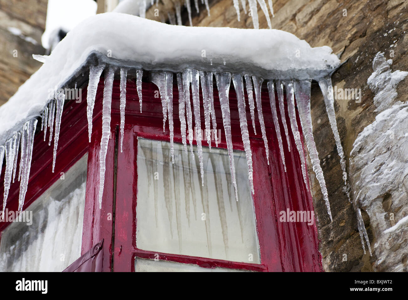 Icicles hanging from a building Stock Photo