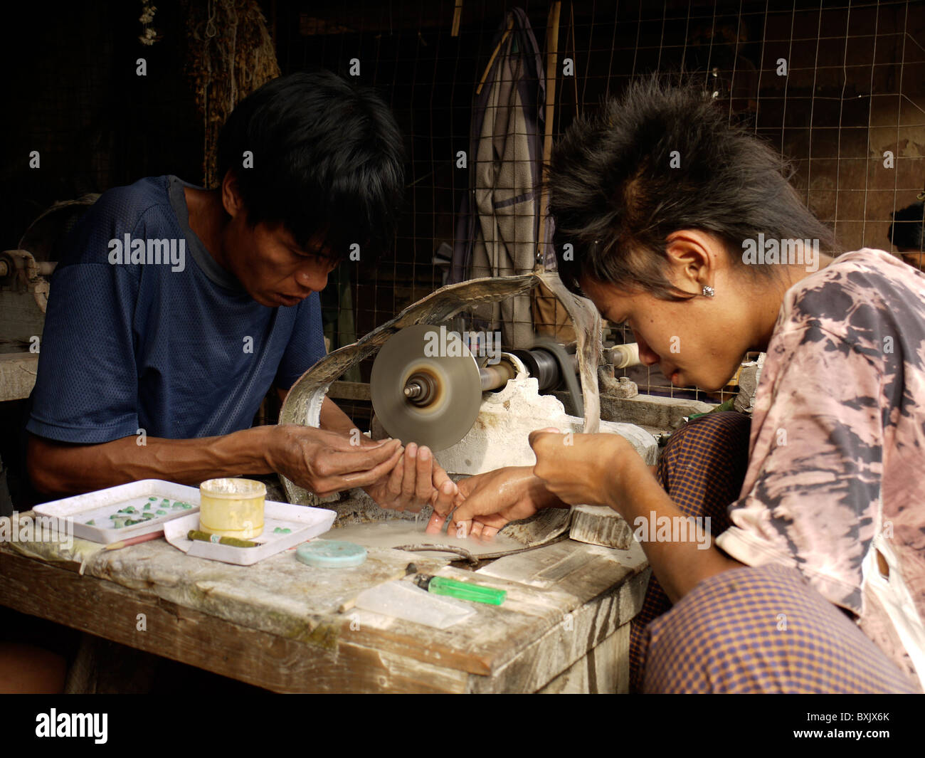 Man polishing jade in the Jade Market, Bin Kyaung, Mandalay, Burma
