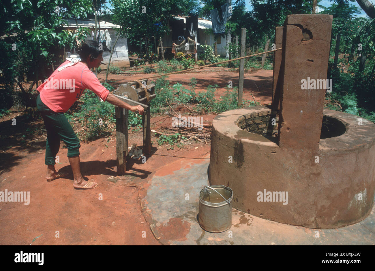 Woman fetching water from well hires stock photography and images Alamy