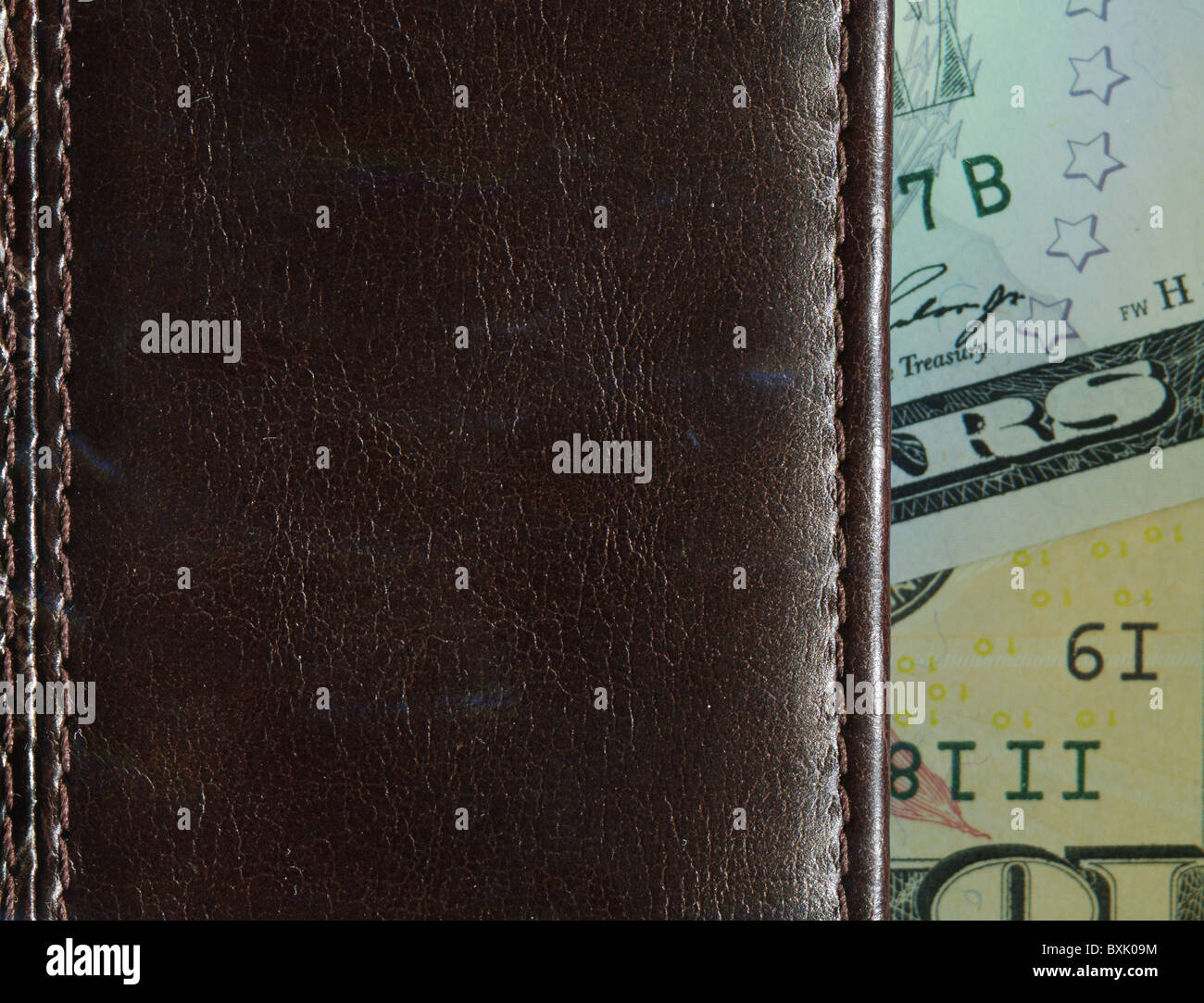 banknotes sticking out of a leather purse Stock Photo - Alamy