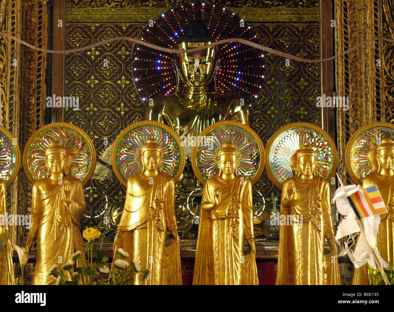 Gold Buddhist statues in the Sule Pagoda, Yangon, Burma Stock Photo