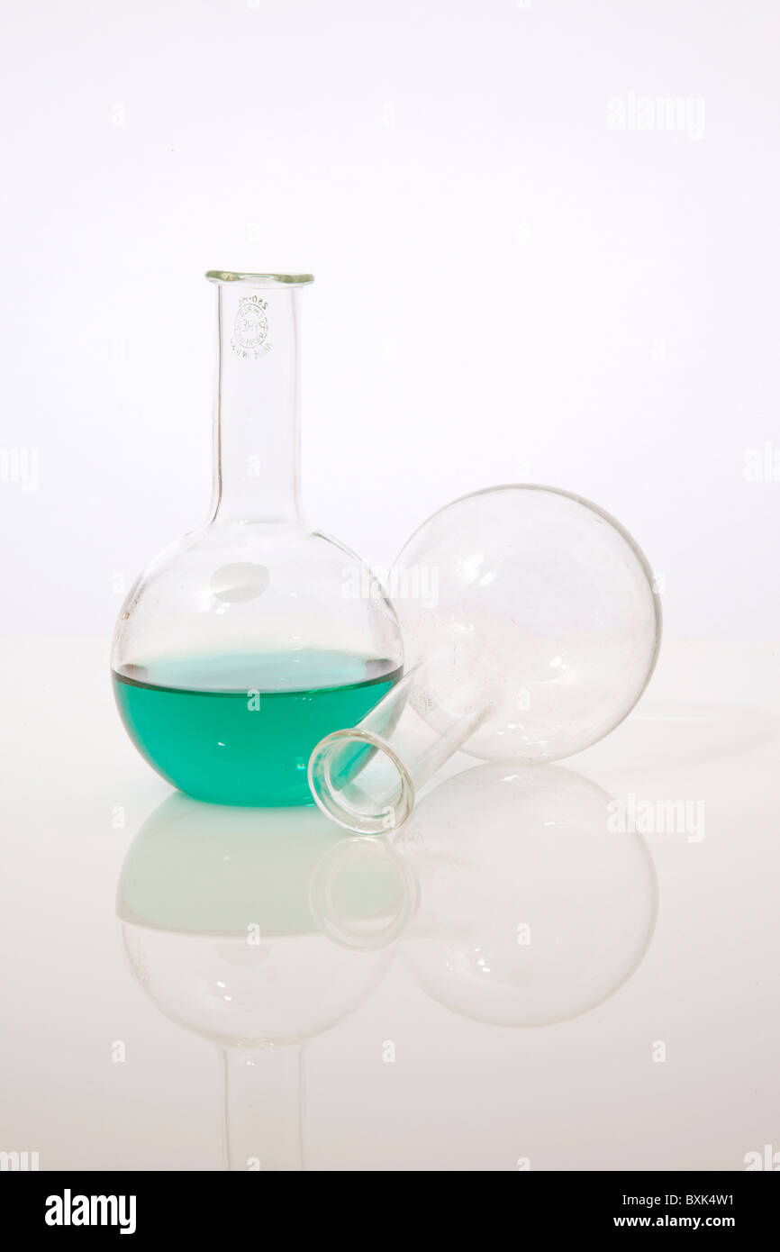 Chemistry flasks with green liquid Stock Photo