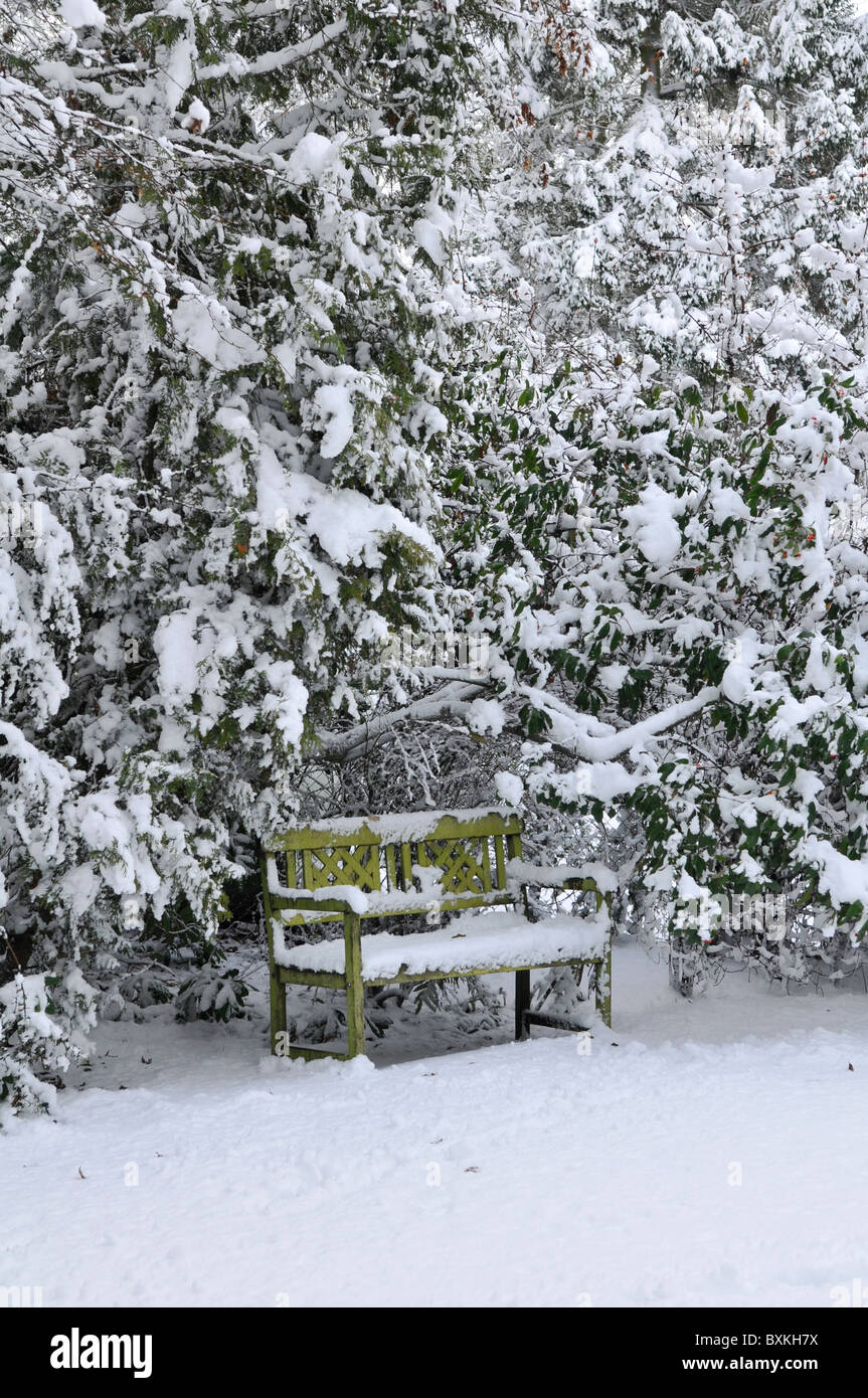 Garden bench in snow. Surrey, England, UK Stock Photo