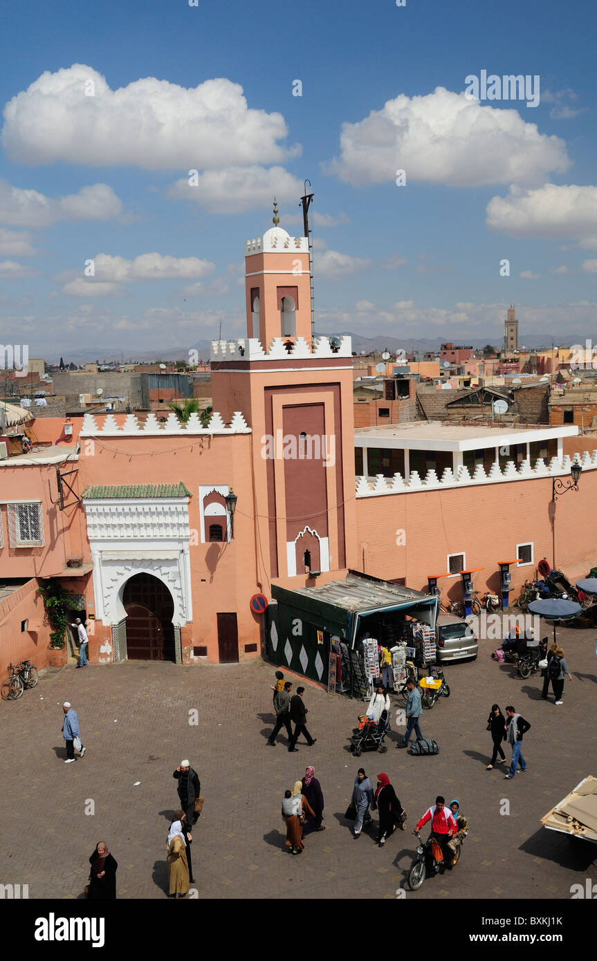 Djemaa el-Fna street with Koutoubia mosque  Viewed from the Cafe Glacier roof terrace in Marrakech Stock Photo