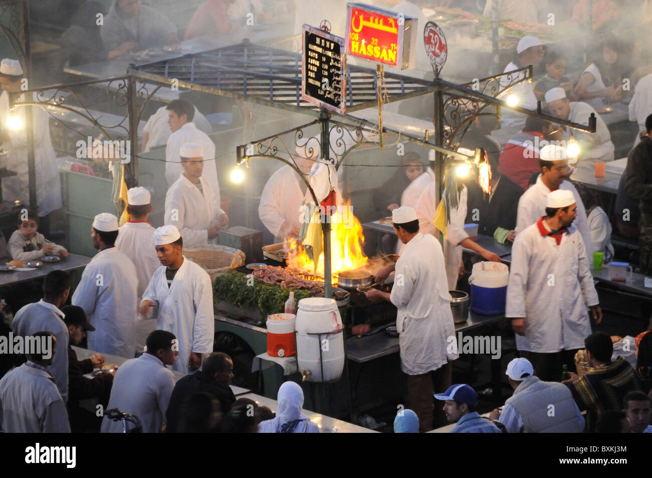 View onto Foodstalls at night from Cafe Glacier at busy Djemaa el-Fna meeting place in Marrakech Stock Photo